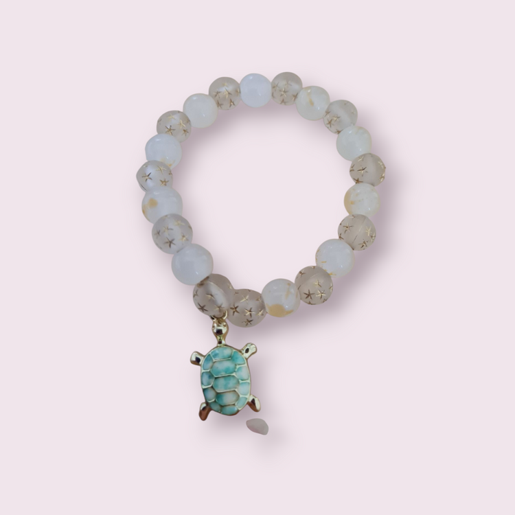 Glass beaded bracelet with charm